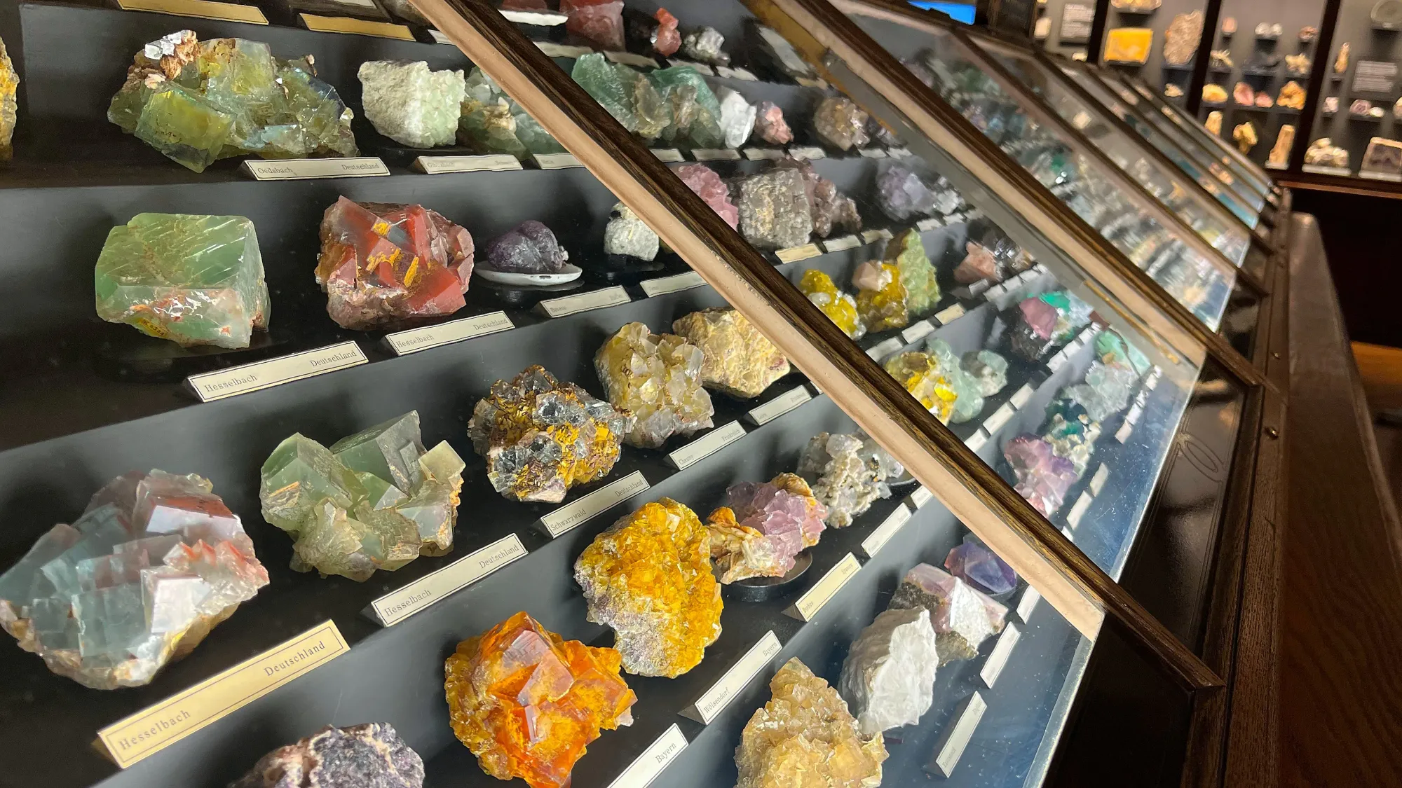 Different colored stones in a slanted cabinet