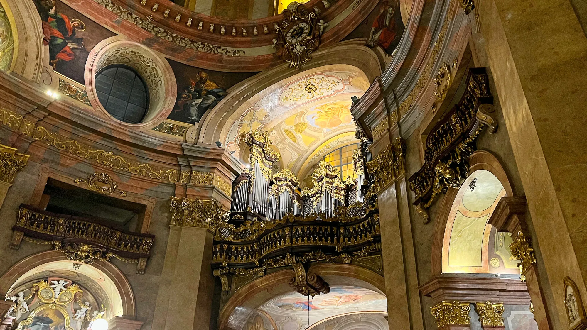 Ornate church ceiling and decadent organ