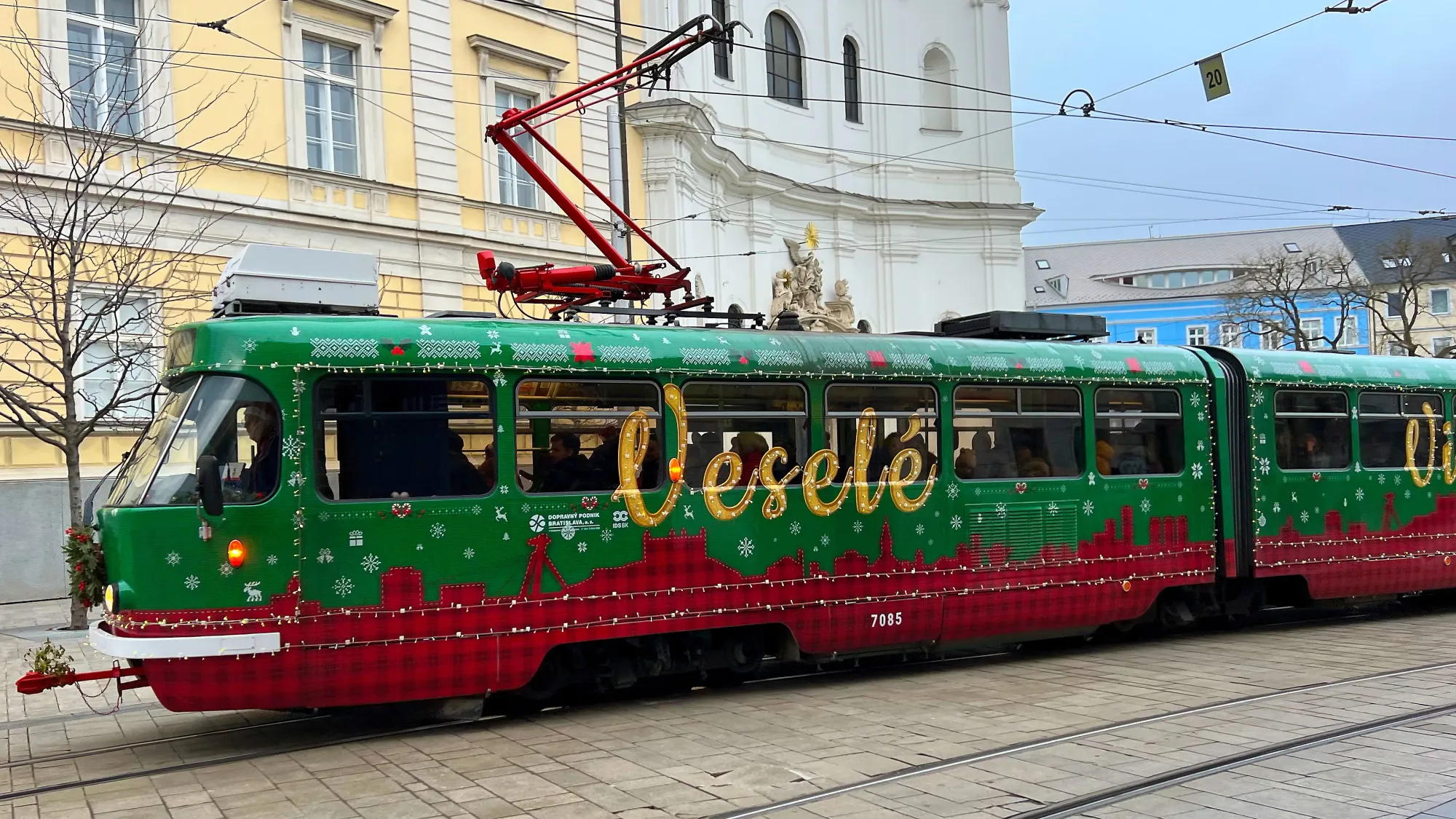 Green and Red checked tram car with golden lettering