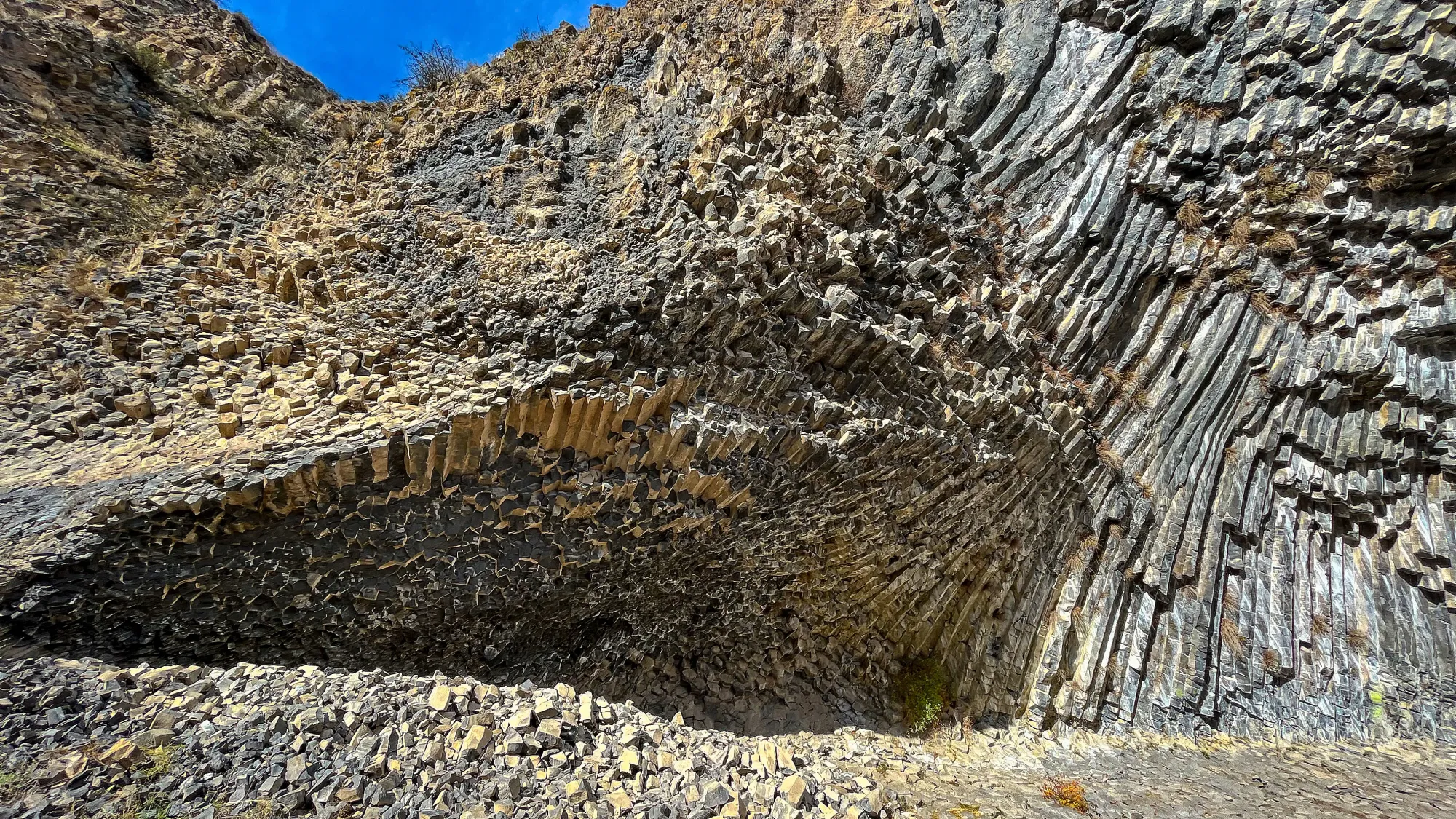 Grey rock pillars in an organic wave