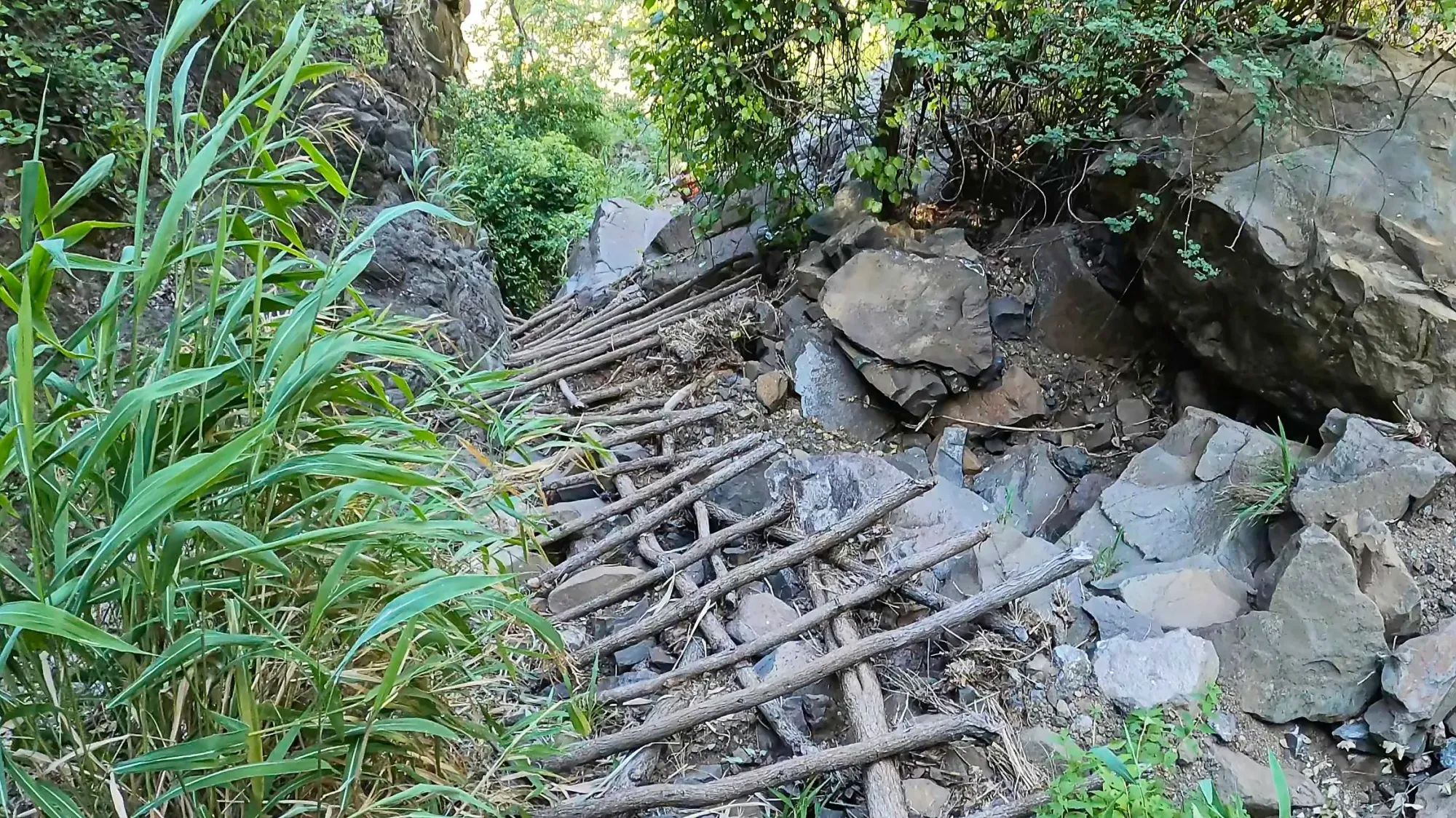 Sticks hewn together over steep rocks