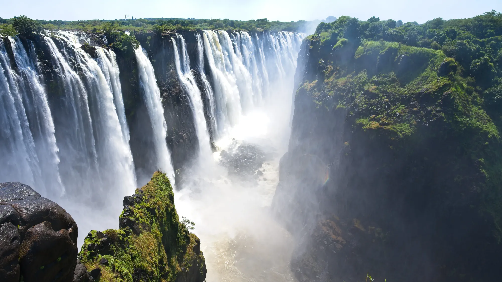 Flowing water into the misty depths