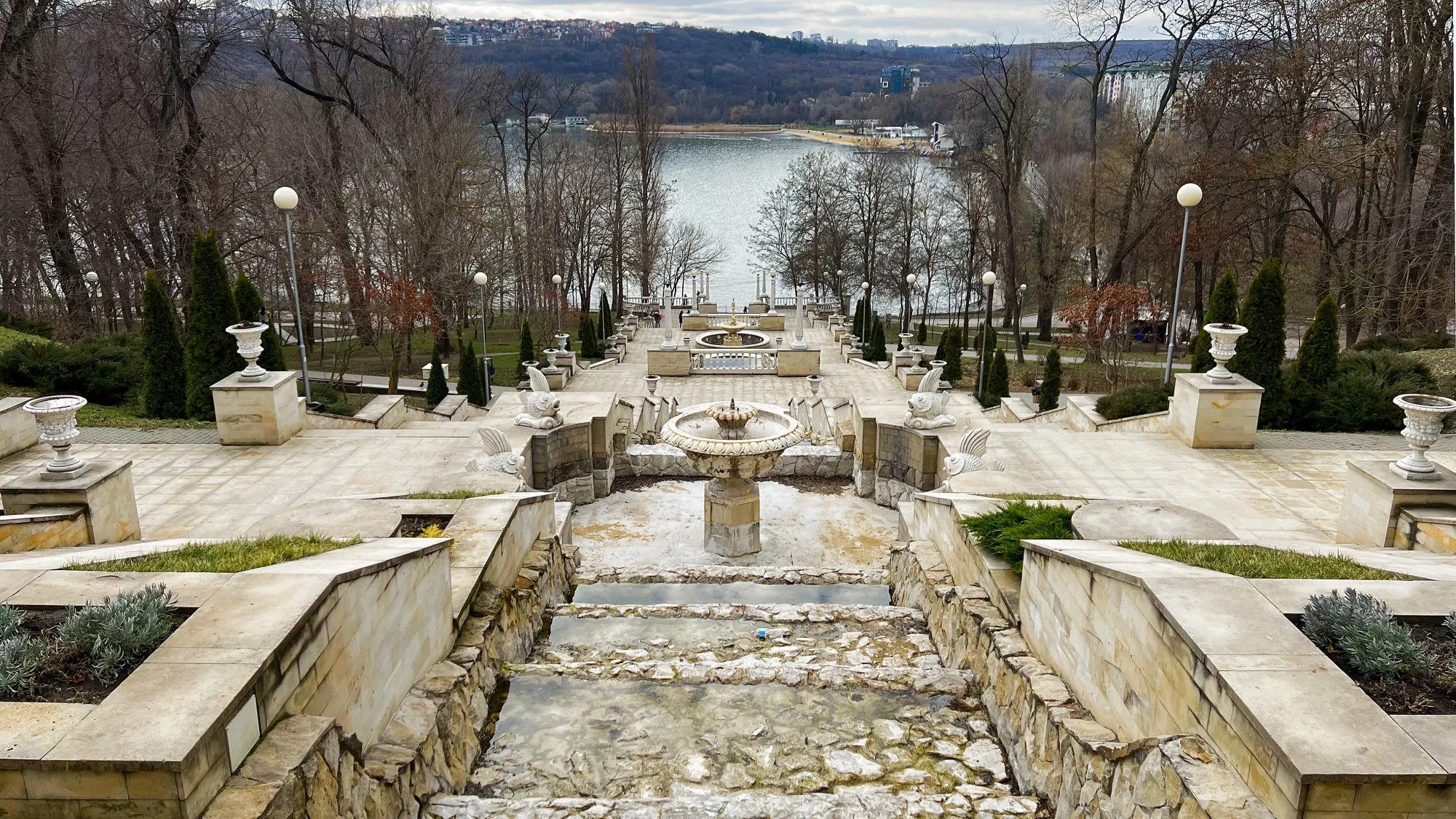 Stone stairwell photographed from above overlooking a lake