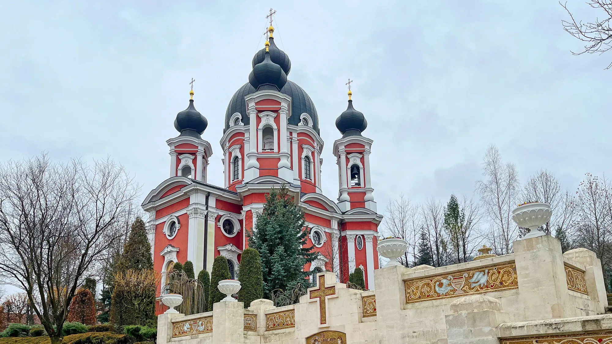 Pink domed church photographed angling up towards the sky