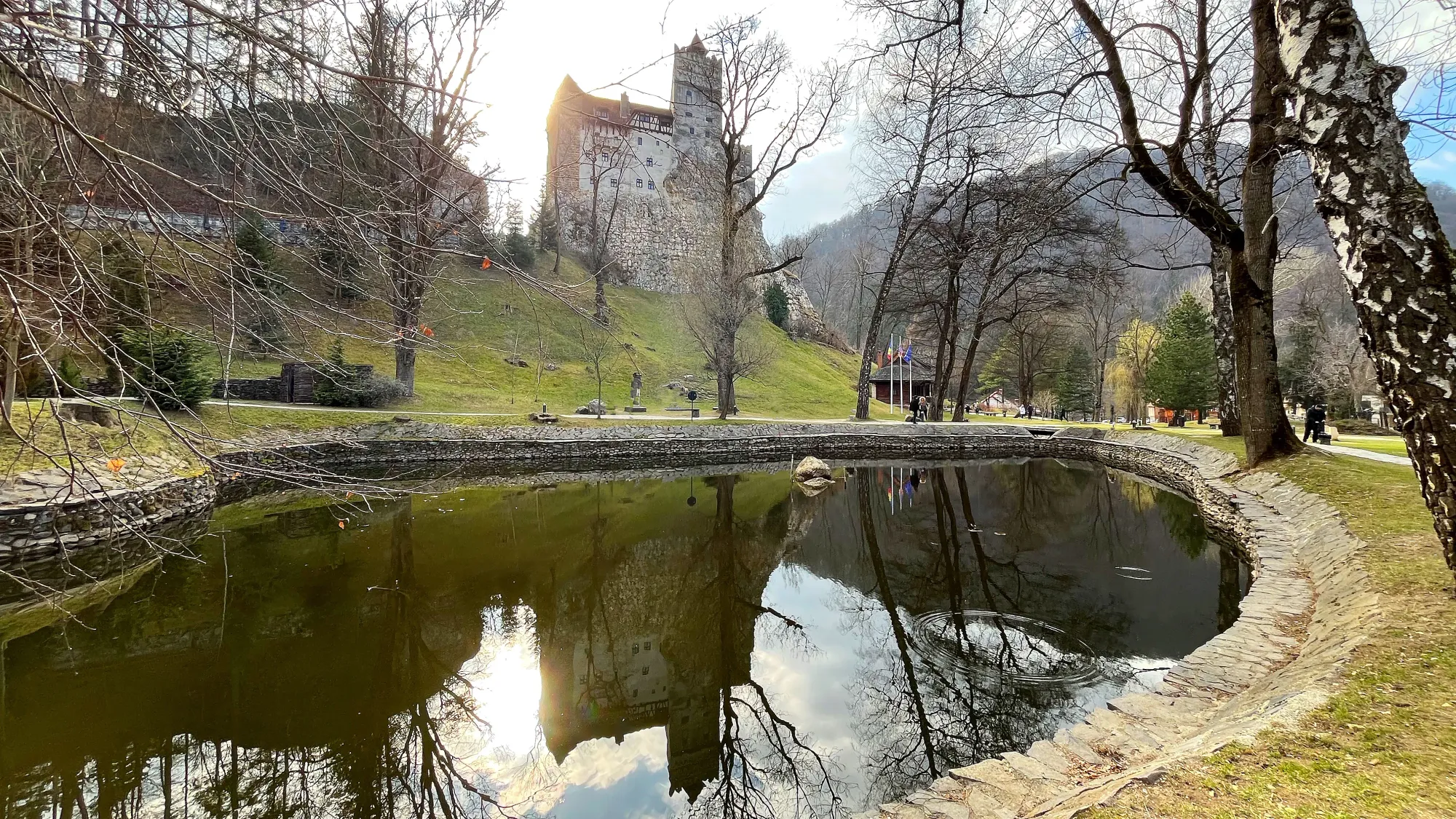 Stone castle reflected in a pond