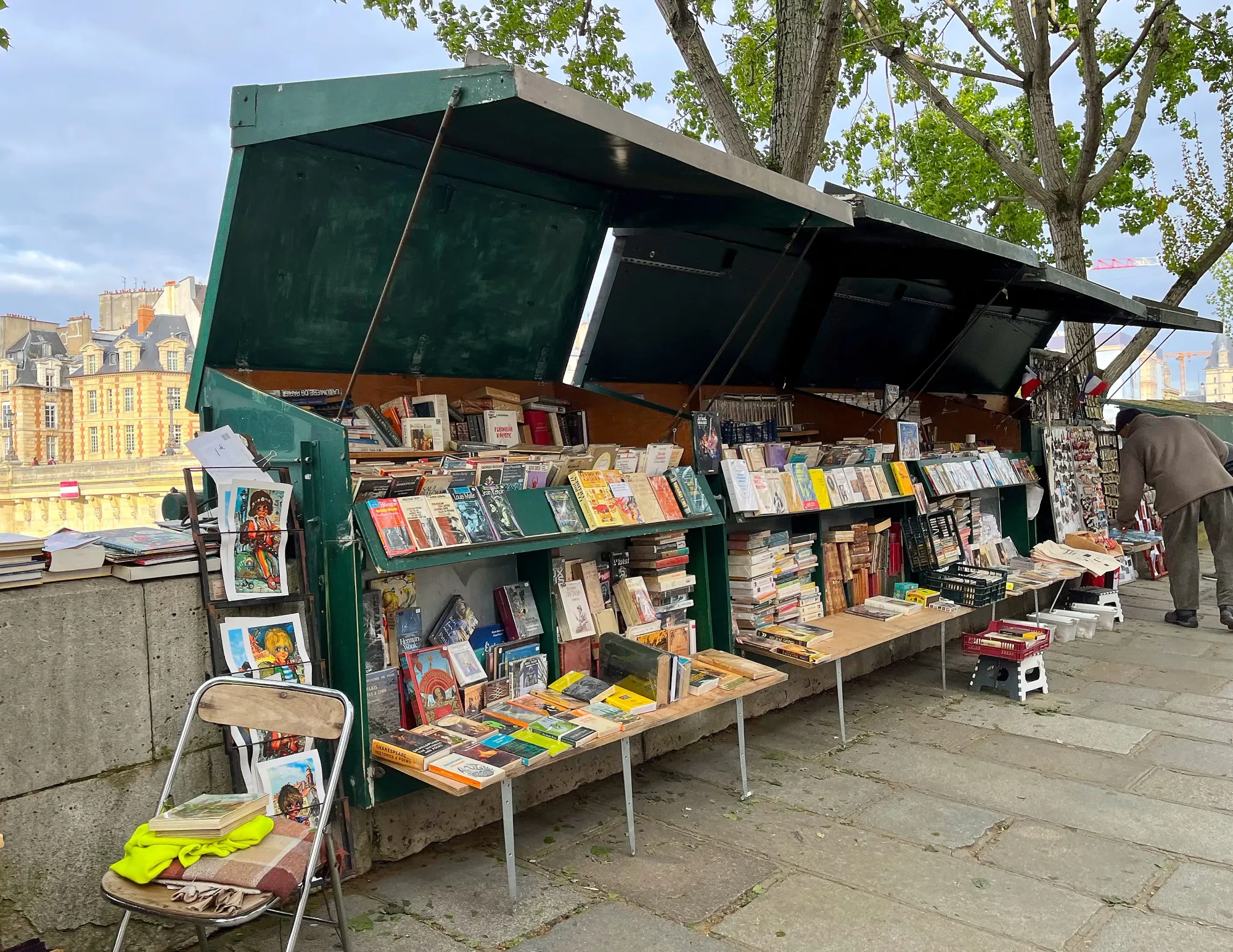 Green covered book stall on the bank of the Seine