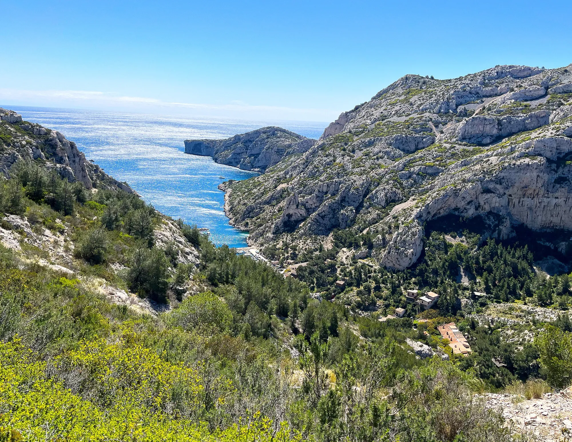 Sparkling blue water nestled in a stone valley