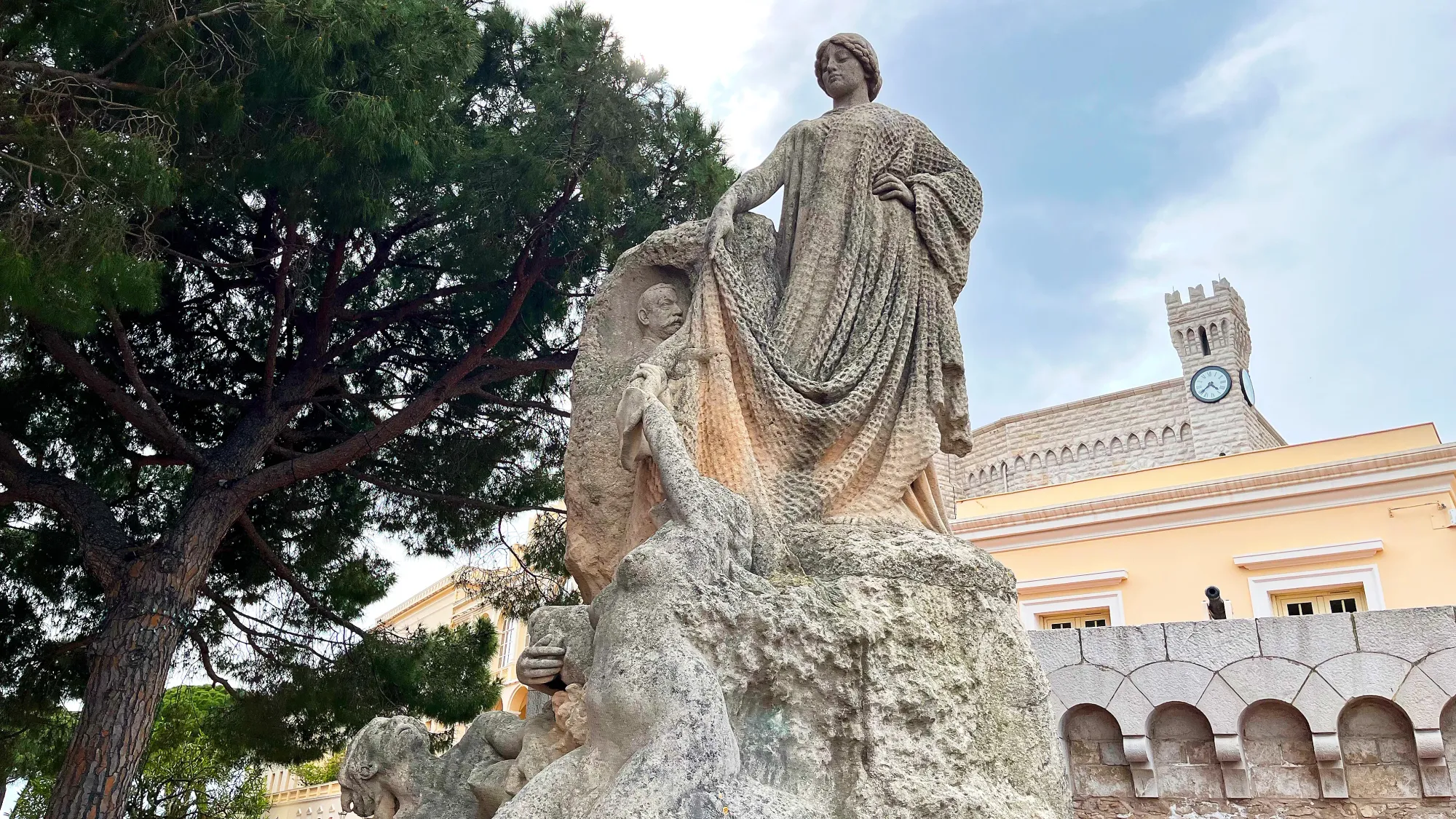 Stone statue with a dramatic fishing net cast over it