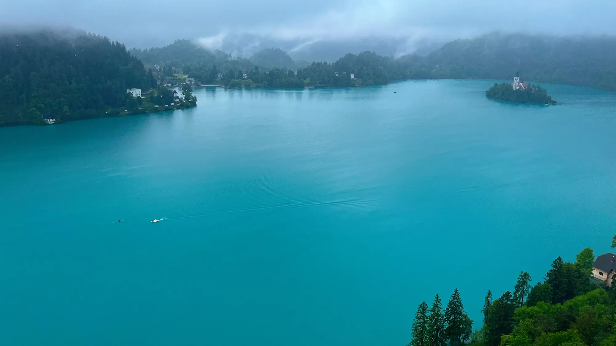 Turquise water with a small island in the center of it